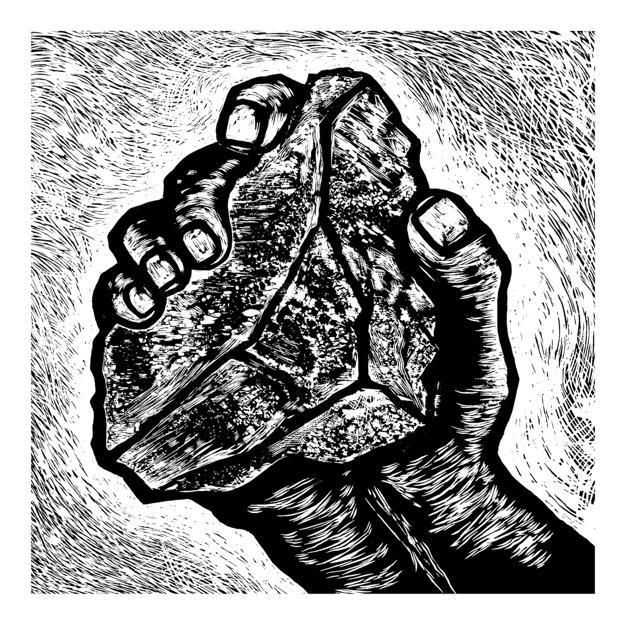 A wood cut of a hand holding a stone.
